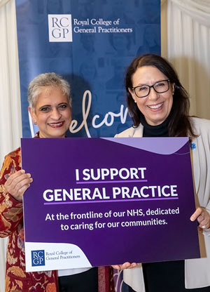 Professor Kamila Hawthorne MP and Debbie Abrahams hold a purple placard sign to support general practice.