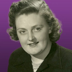 Headshot of Molly Mcbride from the shoulders up smiling