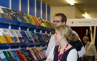 Two people at a bookstand