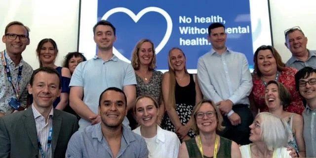 A group photo of the Norfolk and Waveney mental health team.