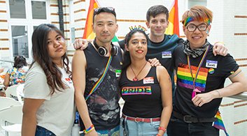 A group of gender activists wearing colourful clothing.