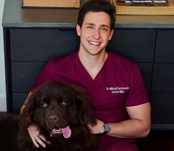 Dr Mike holding his big brown dog