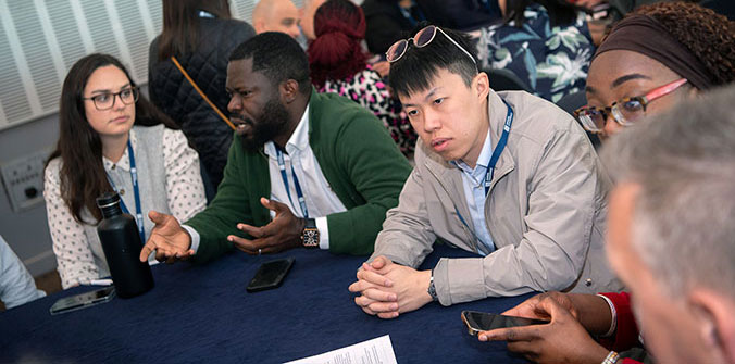 Conference delegates in discussion during workshop session