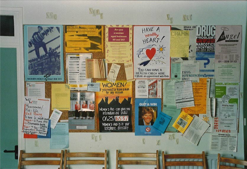 A notice board covered in various flyers