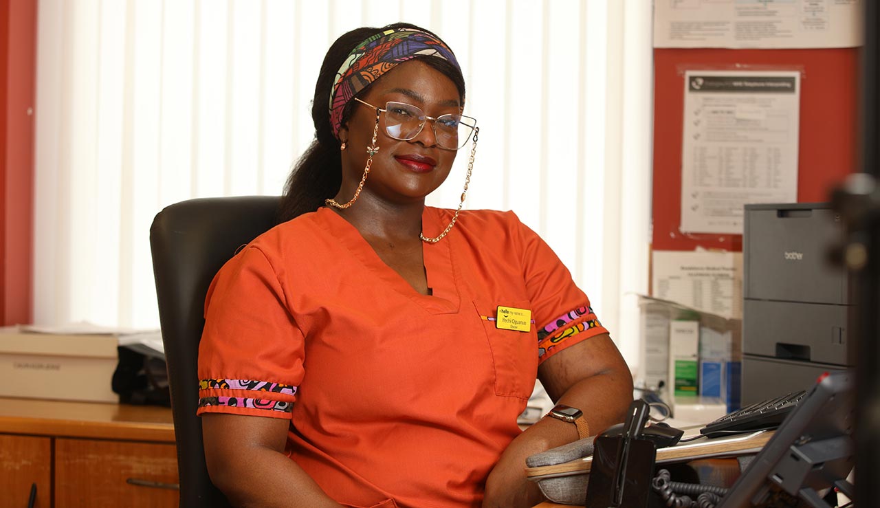 Ifechi Oguanuo sitting at a desk