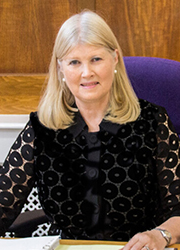 Frances Cranfield sitting at a desk