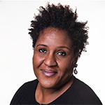 A headshot of Dr Margaret Ikpoh wearing a black top.