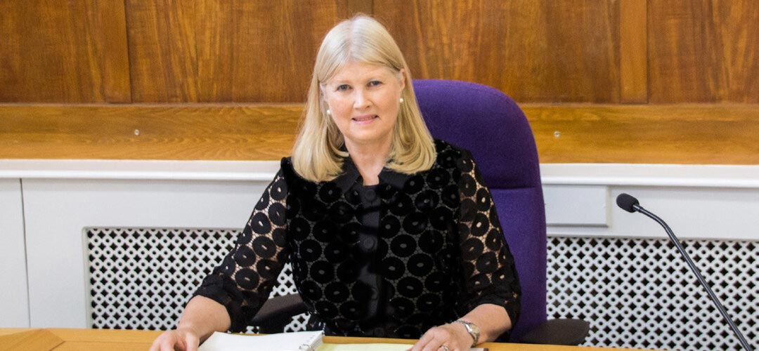 Frances Cranfield sitting at a desk