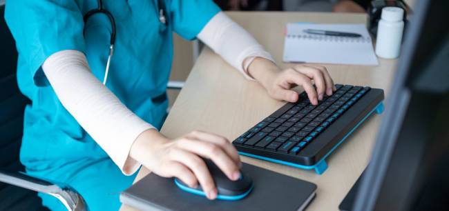 Hand-of-a-nurse-typing-GettyImages-2232823842