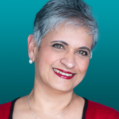 Headshot from the shoulders up of Professor Kamila Hawthorne, smiling and head is slightly tilted to the right.