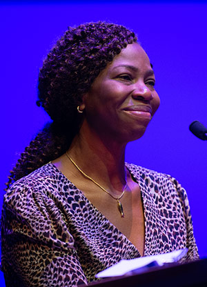 Bola Owolabi speaking at a podium